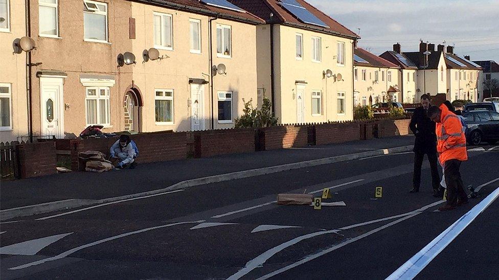 Investigators in street