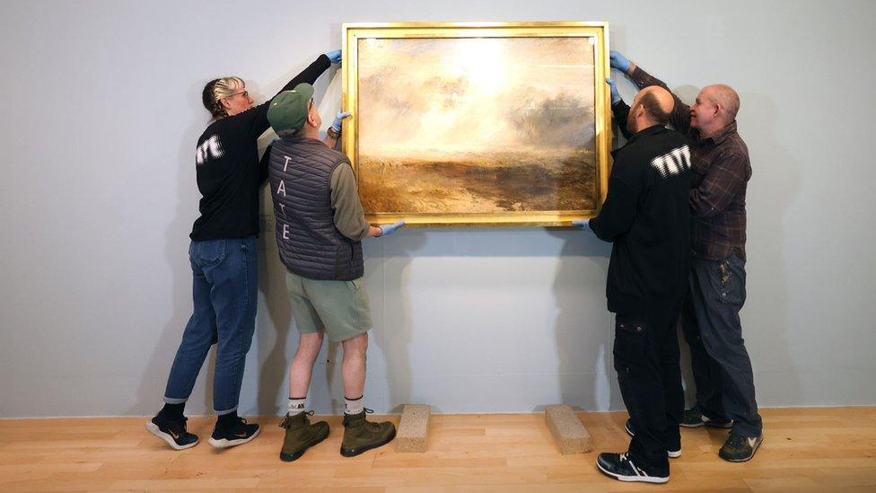 Tate staff removing artwork from wall