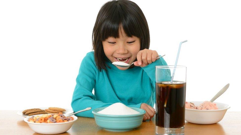 girl eating sugar