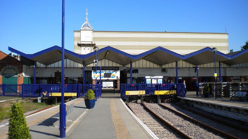 The concourse at Cleethorpes station showing the empty platforms and the station clock tower