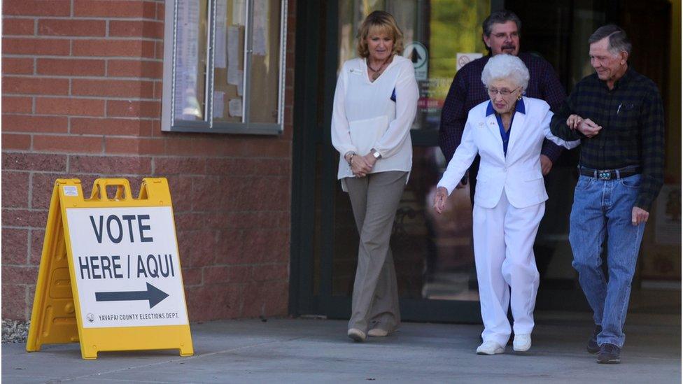 Jerry Emmett, who was born before women won the right to vote in the U.S., leaves the Yavapai County Administration Building, November 1.