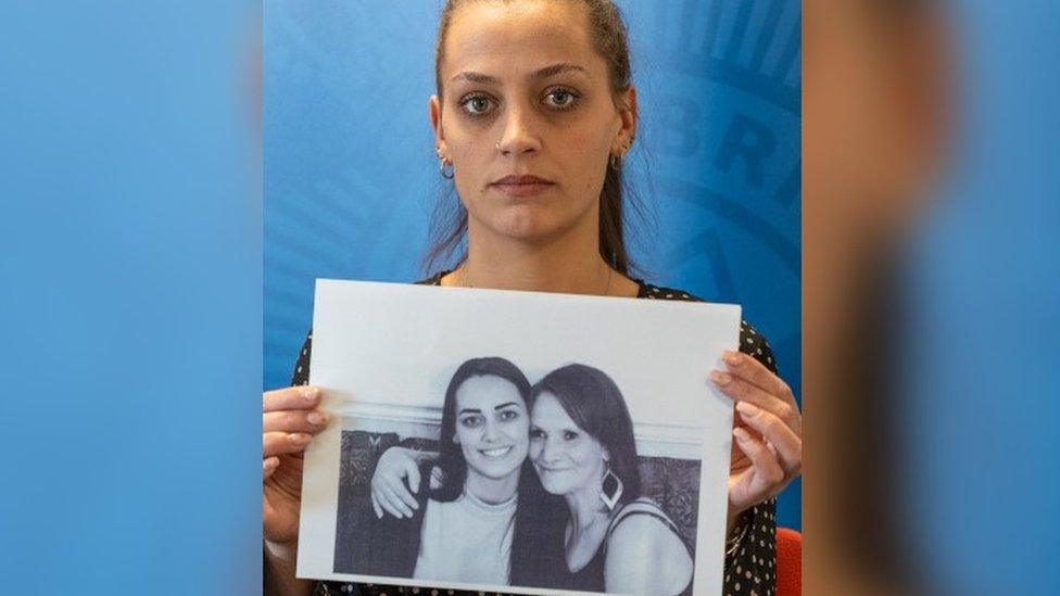 Shannon Brown holding a picture of herself with her mam Michelle Hanson