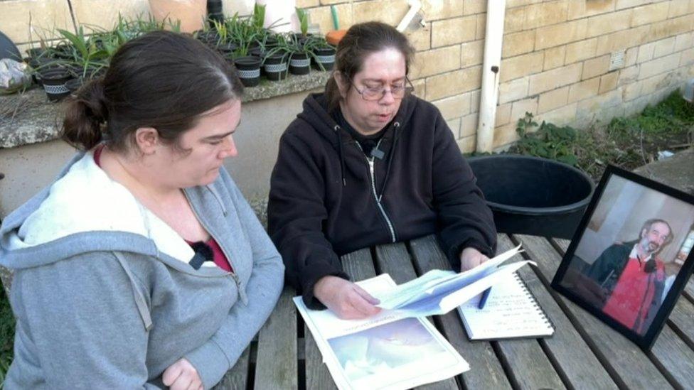 Emma Mogg sitting outside with her daughter