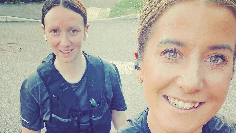 Kathryn Lusk and her friend, Emma Coleman, posing for a photo while out running