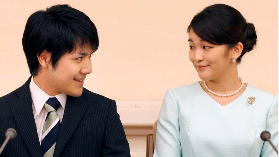 Princess Mako, the elder daughter of Prince Akishino and Princess Kiko, and her fiancee Kei Komuro, a university friend of Princess Mako, smile during a press conference to announce their engagement at Akasaka East Residence in Tokyo, Japan, September 3, 2017.