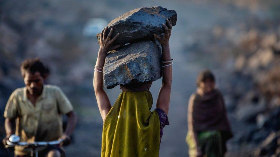 woman carries coal in Jharkhand, India