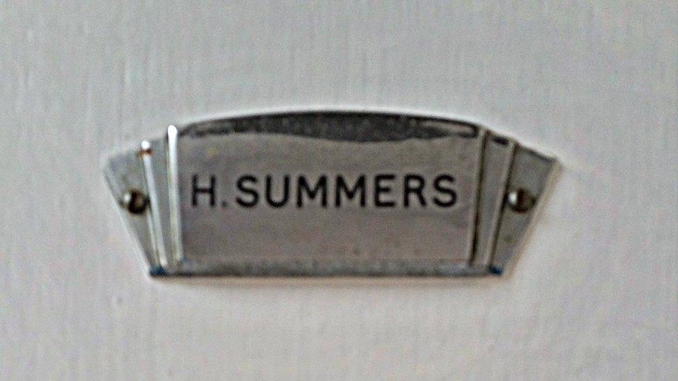 The nameplate on Henry's front door