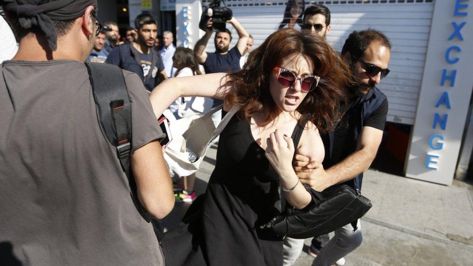 A participant is detained by Turkish police during the Istanbul LGBT Pride Parade