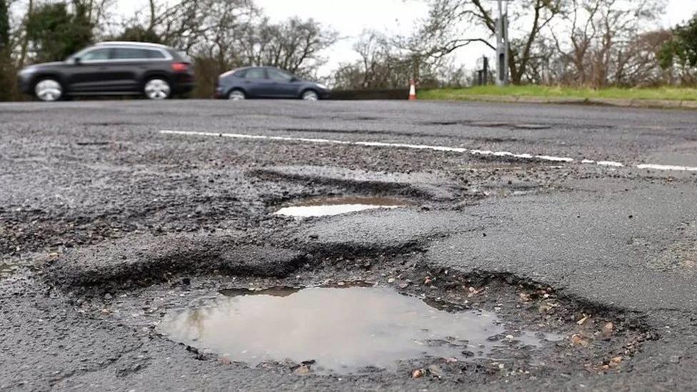 Large pothole in foreground