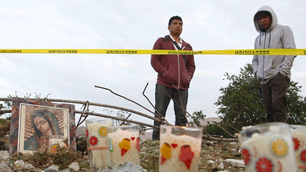 Candles laid out at the site of the blast