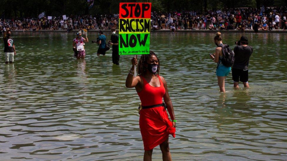 Stop Racism Now sign during the 57th annual March on Washington, Friday, August 28, 2020 in Washington