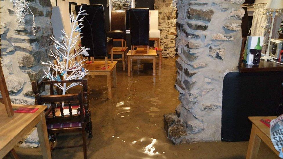 Flood water inside The Union Inn, Tremadog, Gwynedd