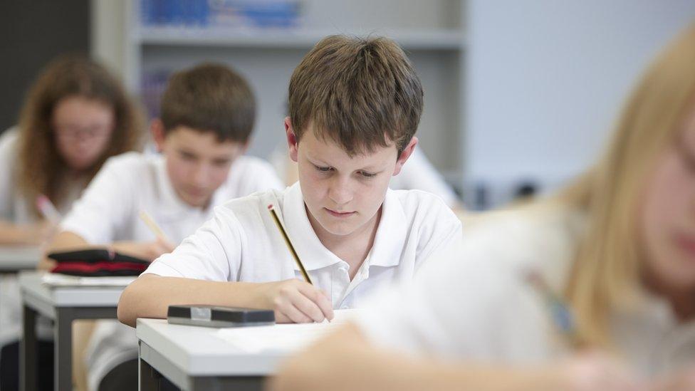 Children taking an exam