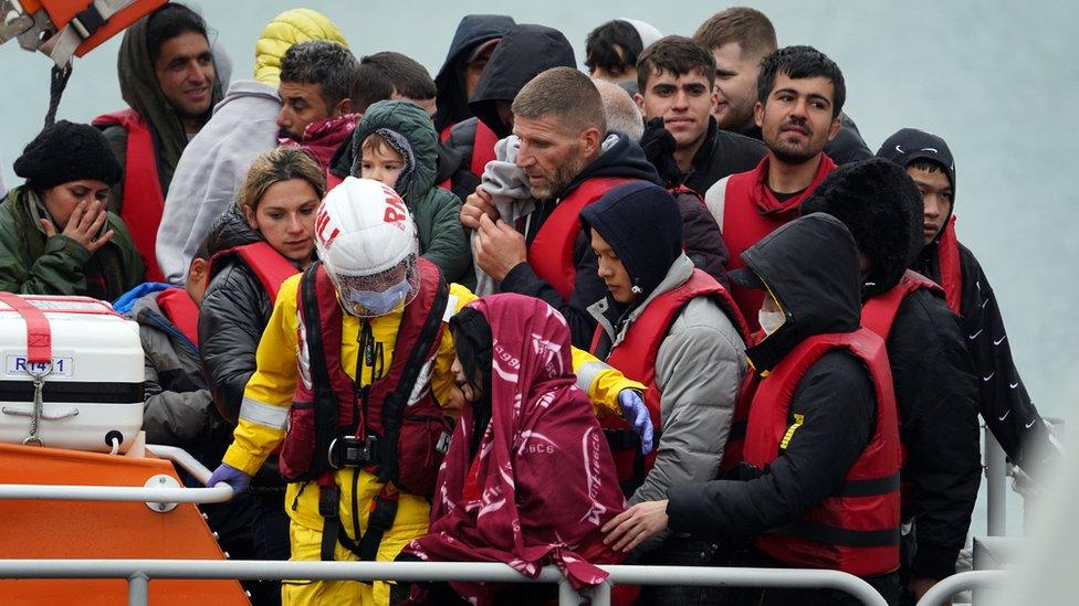 A group of people thought to be migrants are brought in to Dover, Kent, onboard the RNLI Dover Lifeboat