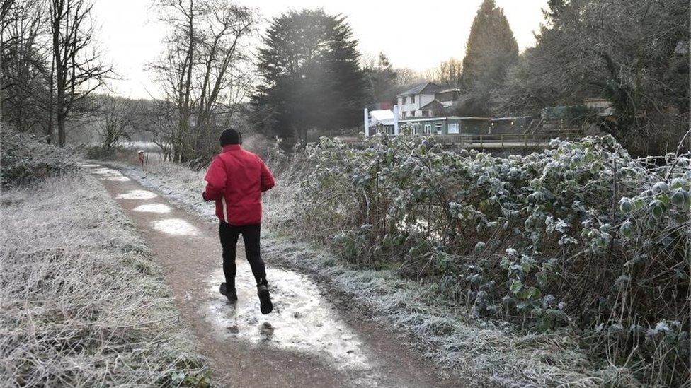 A jogger running by the River Avon in Bristol, pic 31 Jan