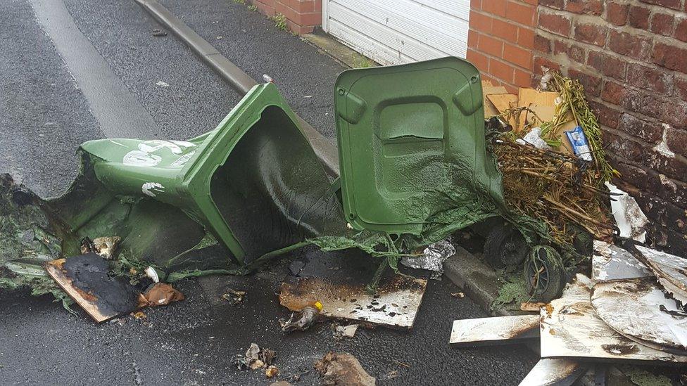 Melted wheelie bin