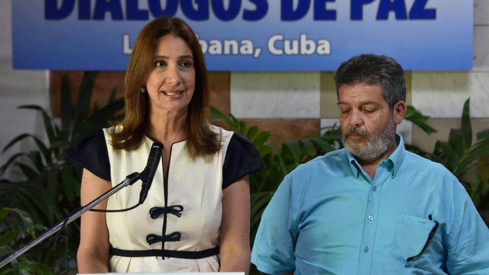 Colombian delegation tor the peace talks with the FARC guerrillas, Marcela Duran (L) reads a statement at the Convention Palace in Havana, on June 22, 2016