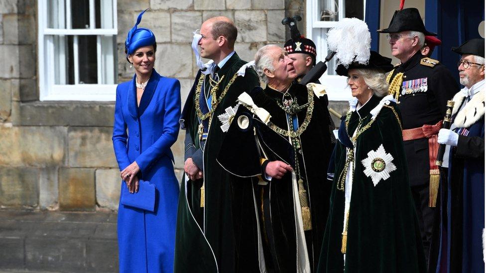 Prince William and Catherine, Princess of Wales, King Charles III and Queen Camilla, view the fly past by the Red Arrows outside the Palace of Holyroodhouse