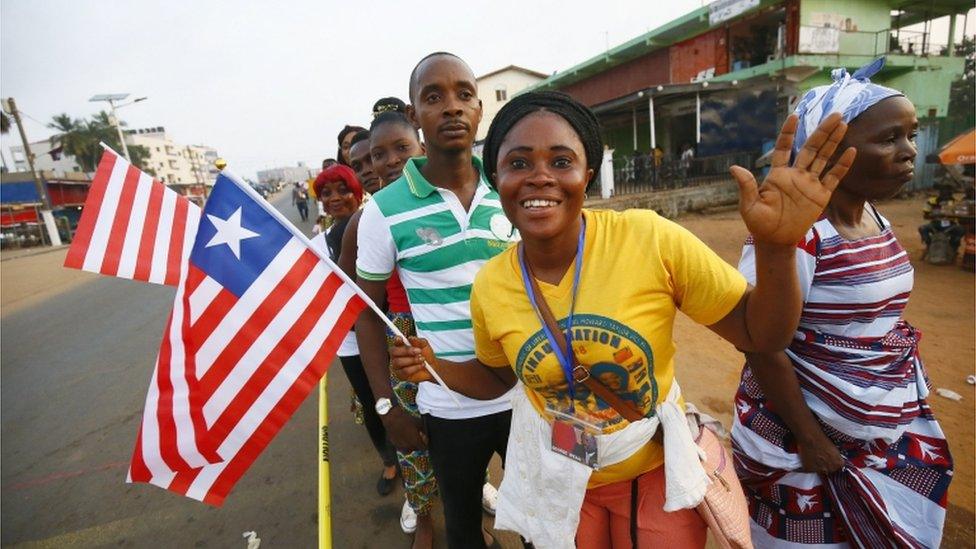 Liberians cheer as they stand in line to enter the inauguration off the President-elect, George Weah, at the Samuel Kanyon Doe stadium, in Monrovia, Liberia, 22 January 2018.