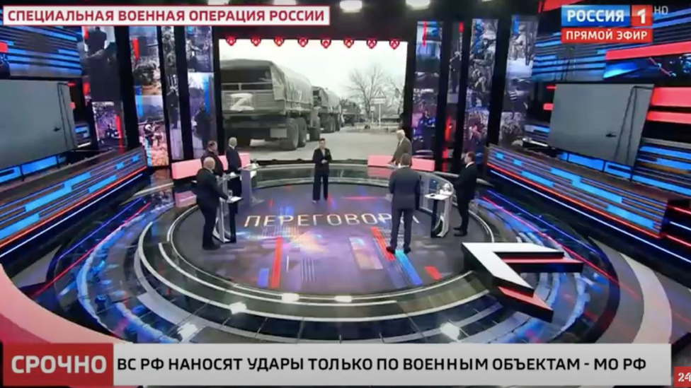 A screenshot from a Channel Rossiya 1 TV broadcast. An aston refers to the war in Ukraine as a "special operation"