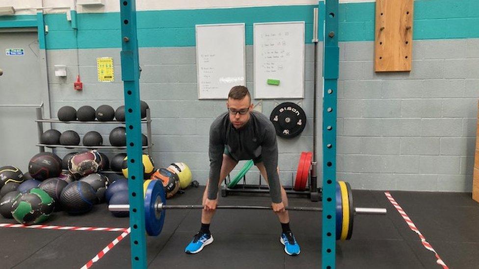 Andrew deadlifting weights in gym