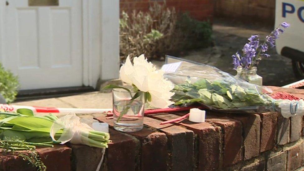 floral tributes at the scene