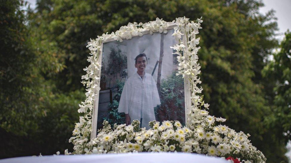 A photo of Kian Delos Santos, 17, on top of the hearse during his funeral on August 26, 2017