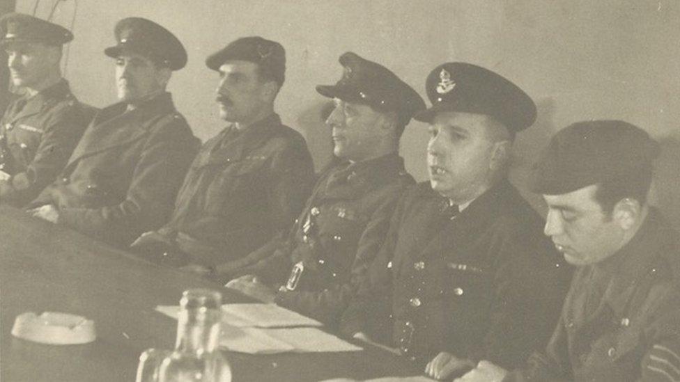 Walter Brook (fourth from left) chairing an anti-Nazi tribunal