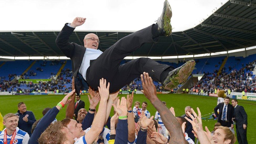 Brian McDermott held aloft by Reading players after promotion in 2011/12