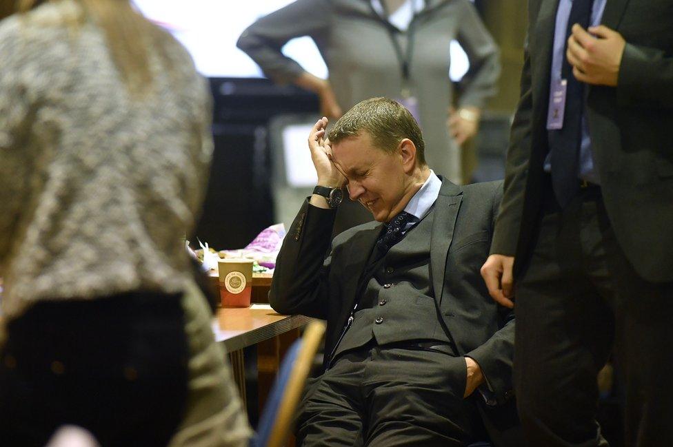 An official reacts as vote counters wait for ballot boxes to arrive at the Peter Paine Performance Centre for the constituency of Boston and Skegness