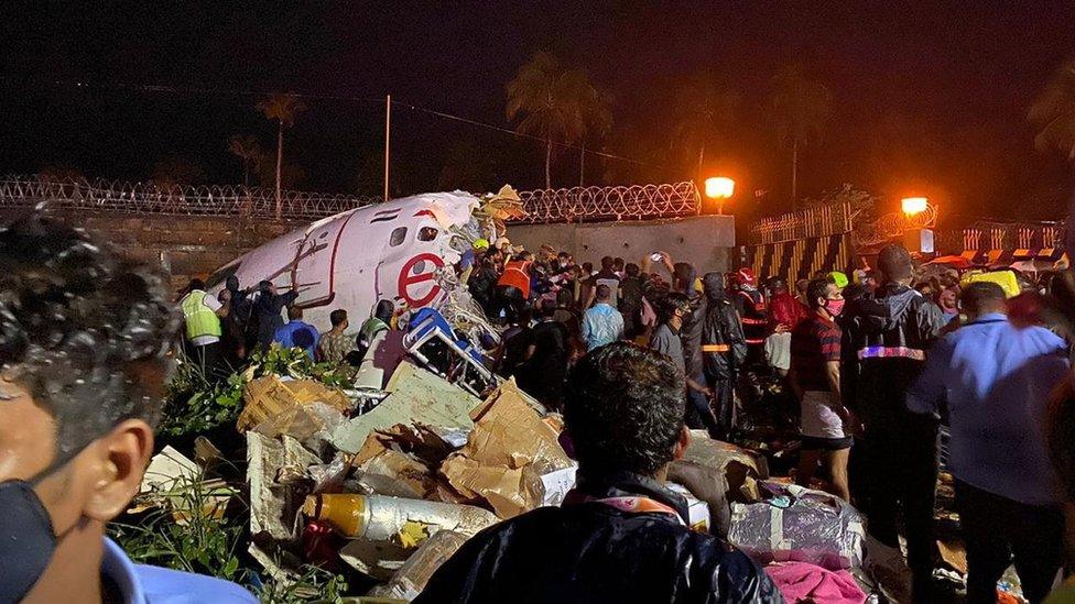 Indian Civil Defence handout photo shoes the wreckage of Flight IX 1134 at Calicut airport (7 August 2020)