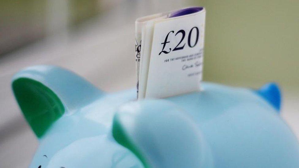 £20 note in a piggy bank