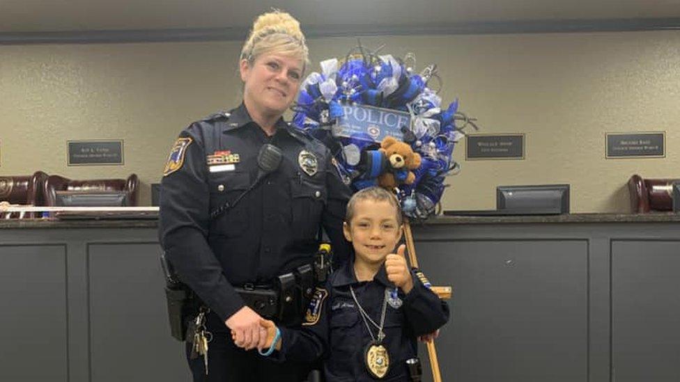 Abigail Arias with a Freeport Police Department officer