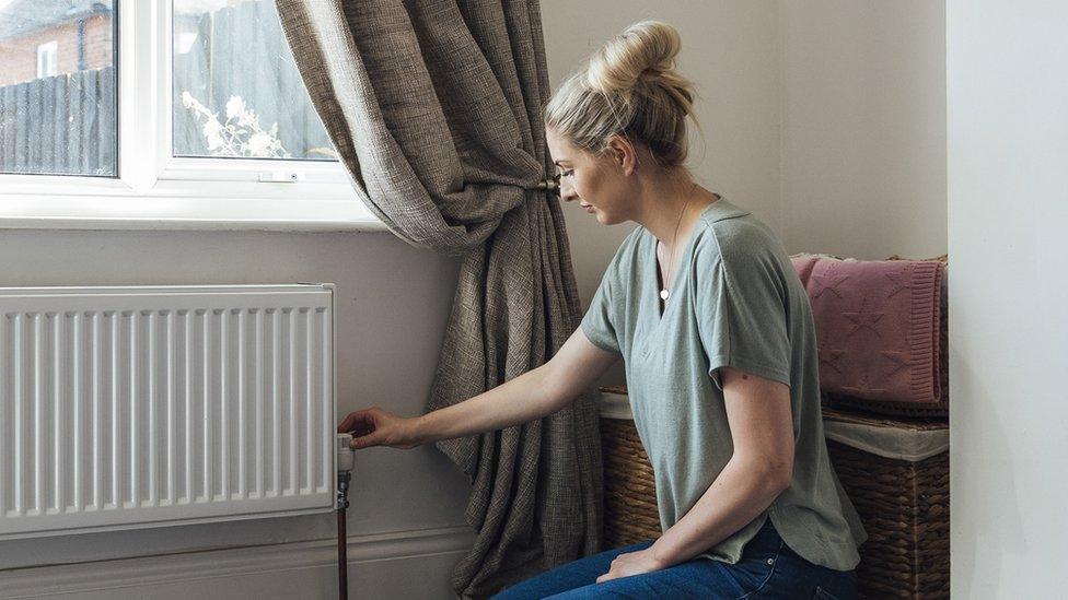 Woman by radiator