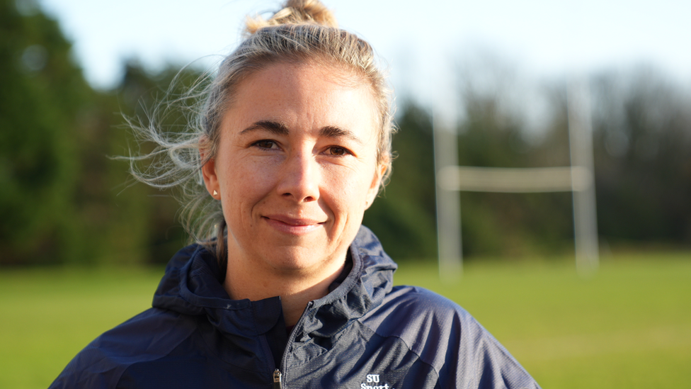 Ex-Wales rugby player Elinor Snowsill standing in front of posts