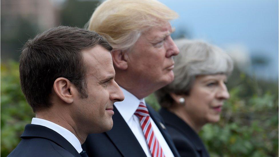 This file photo taken on 26 May 2017 shows (L-R) French President Emmanuel Macron, US President Donald Trump and Britain's Prime Minister Theresa May