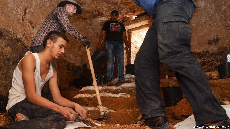 Archaeologists uncovering steps into the ritual bath