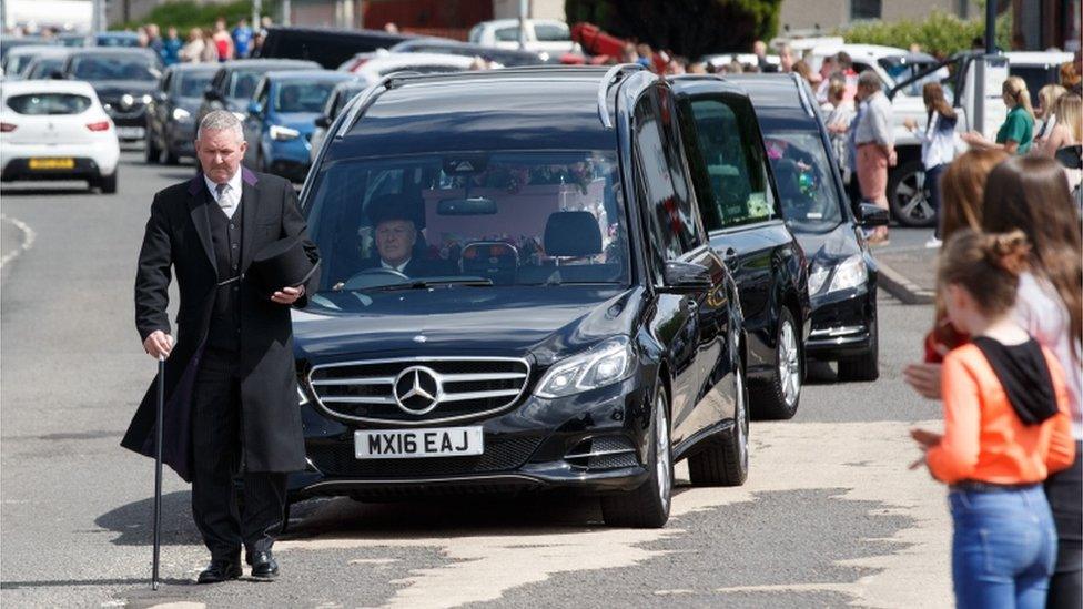 Fiona's pink coffin led the procession as local people paid their respects