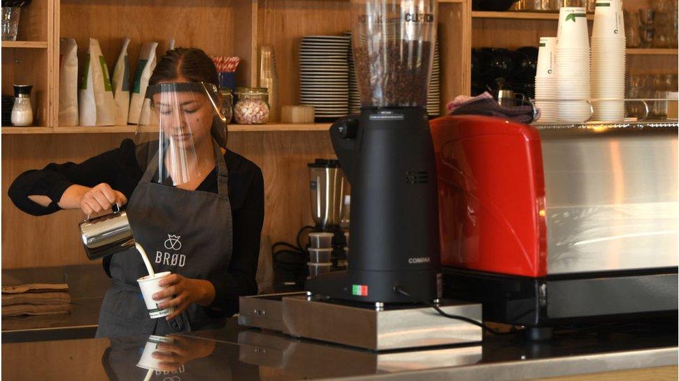 Barista makes a takeaway coffee Brod Danish bakery and coffee shop, June 2020, Penarth