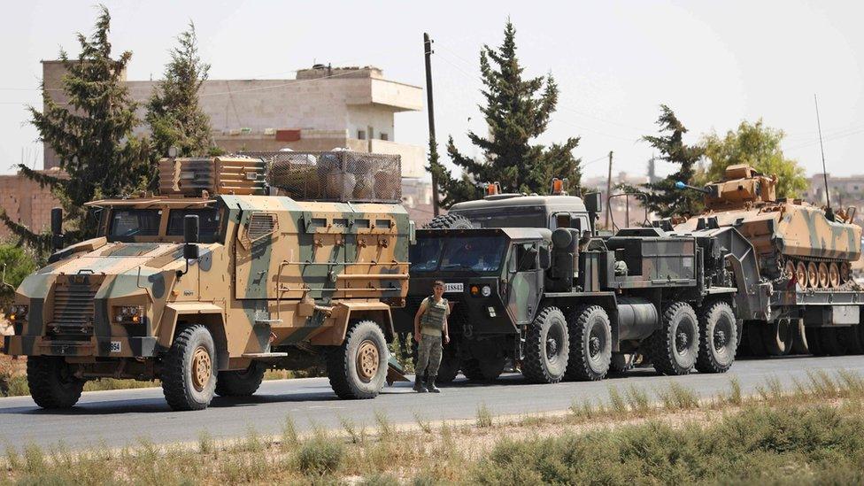 Turkish military vehicles seen in a convoy near the Syrian town of Saraqeb, in Idlib province (29 August 2018)