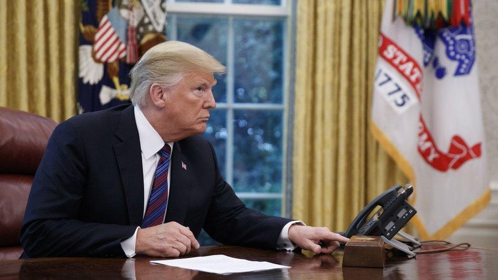 US President Donald J. Trump tries to connect the phone line with Mexican President Enrique Pena a Nieto to announce a trade deal in the Oval Office of the White House in Washington, DC, USA, 27 August 2018.