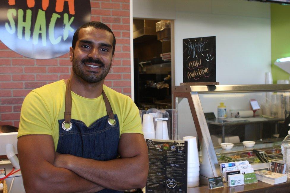 Pita Shack worker and Iraqi refugee Adil is in the process of applying for the US Army