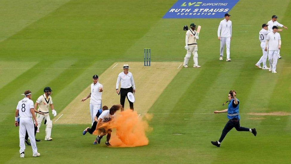 A protester is rugby tackled to the ground by security