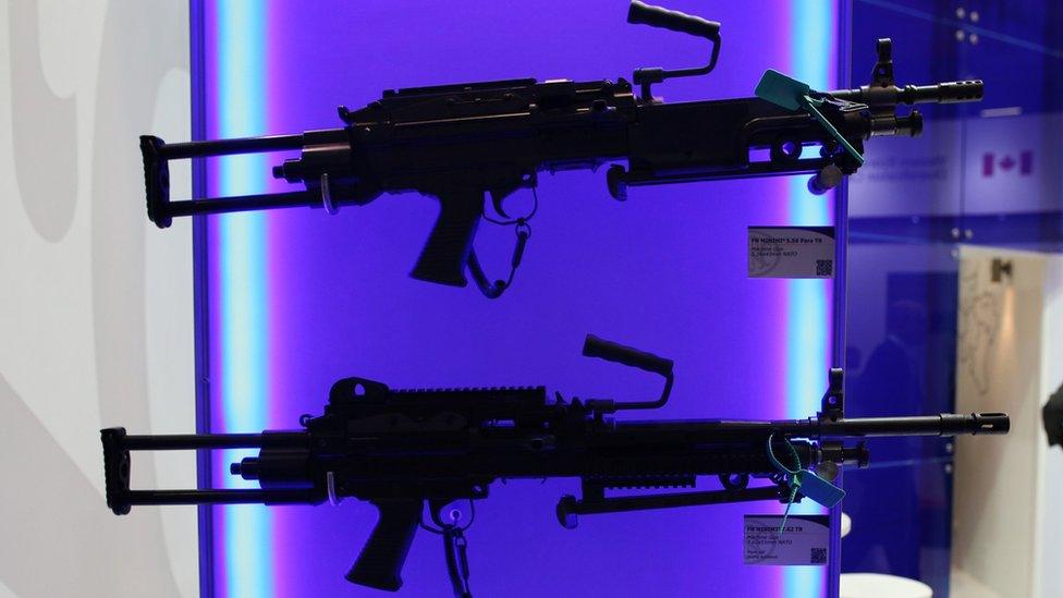 Belgian rifles are displayed at the Defence and Security Exhibition in London (10 Sept 2013)