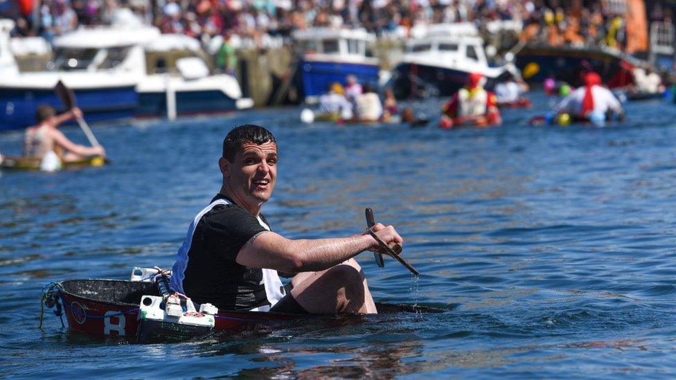 A tin bath race competitor sinking in Castletown harbour