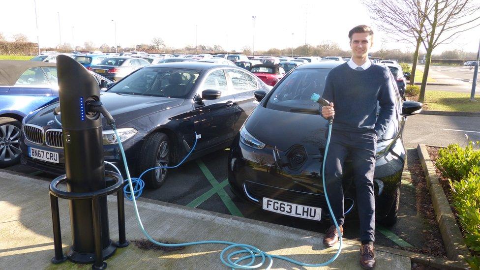 Matthew Thomason with his electric car