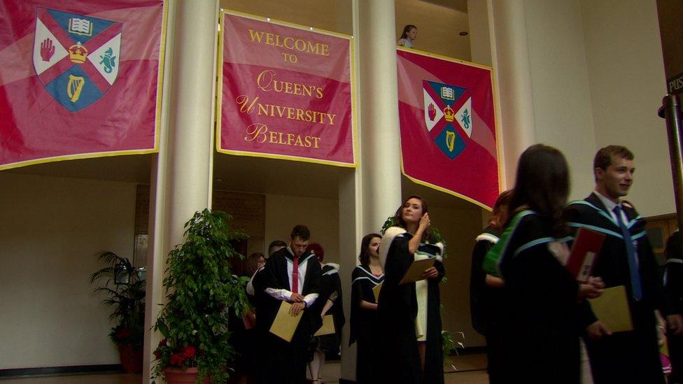 Young people leave their graduation ceremony at Queen's University in Belfast