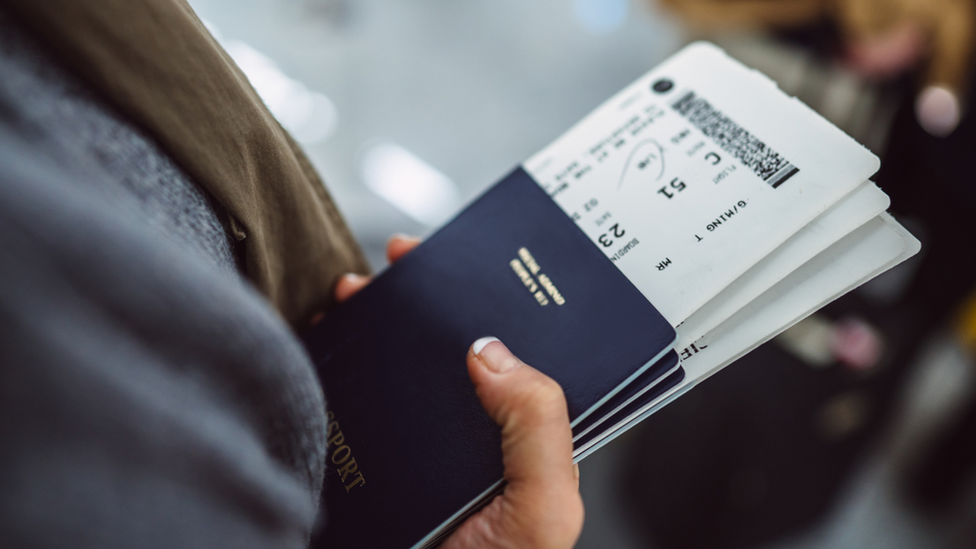 Woman holding passport