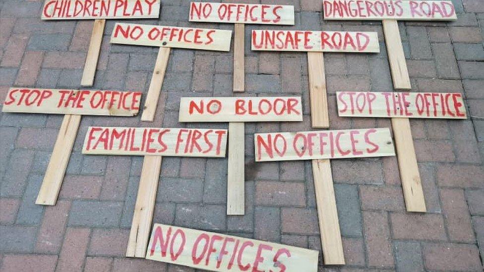 Signs protesting development