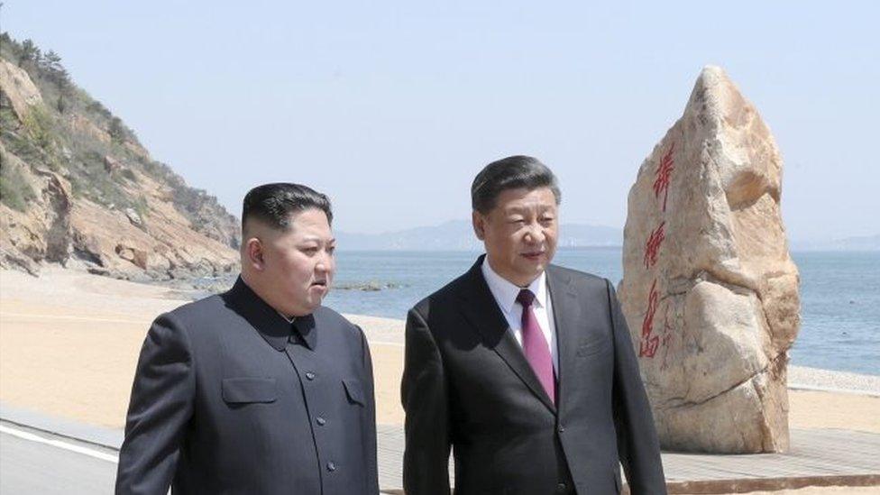 Chinese President Xi Jinping (right) and North Korean leader Kim Jong-un meet in Dalian, Liaoning province, China in this picture released by Xinhua on May 8, 2018.